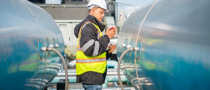 Industrial Engineer Checking Equipment with Tool